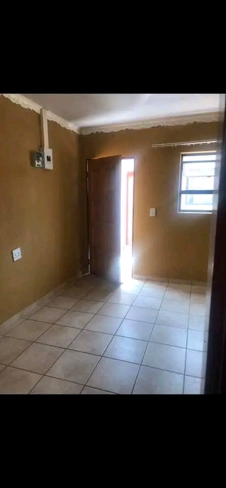An open-concept bachelor pad , accompanied by  in Dobsonville