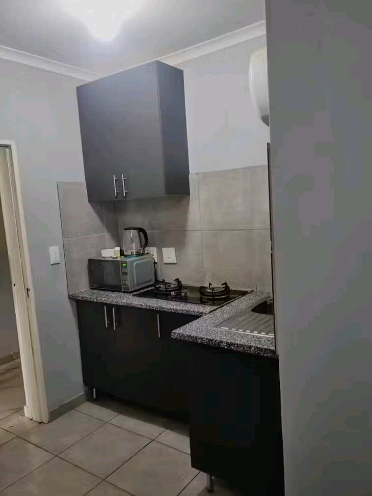 A bachelor unit(upstairs) with a small fitted  in Kempton Park