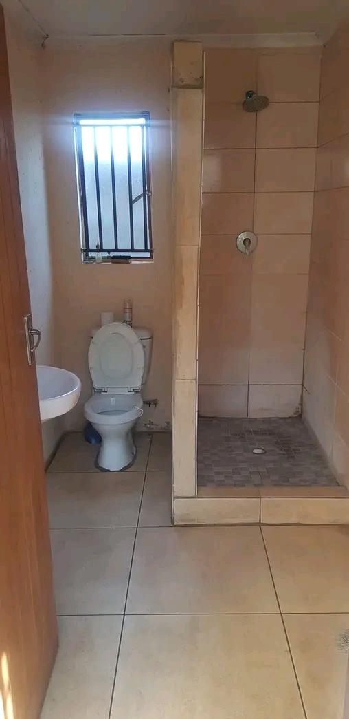 Room to rent ext 16. secured yard. shared toi  in Protea Glen
