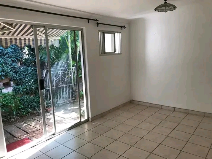 Glass sliding doors into living area with fri  in Berea