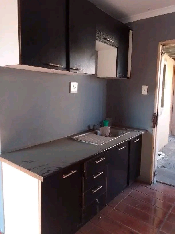 Bachelor flat. kitchen with kitchen cupboards  in Birch Acres