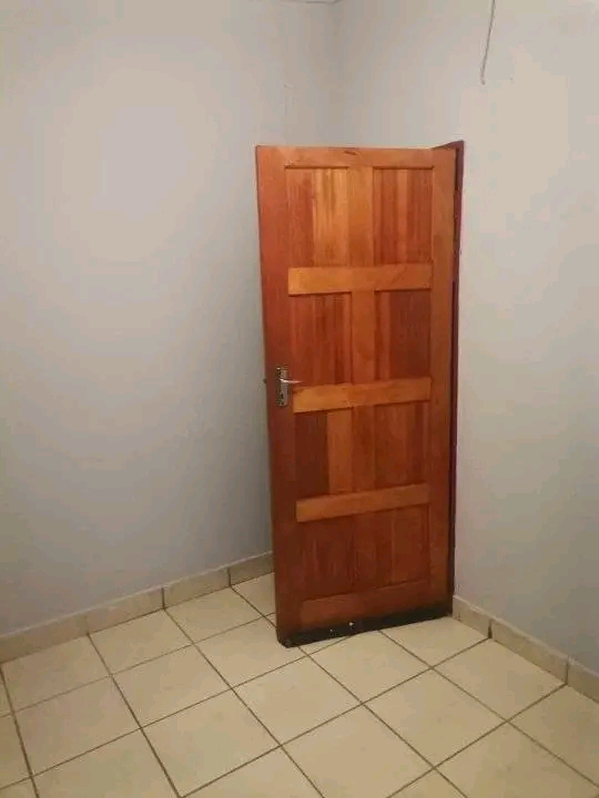 An open plan room  with a shower, basin and t  in Birch Acres